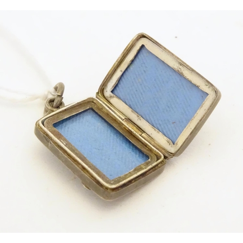 225 - A Victorian silver pendant formed locket of squared form with riding whip detail to front. Approx 1