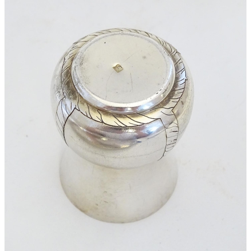 231 - A French novelty cocktail / tot set, the shaker formed as a bottle, the 6 shot / tot cups formed as ... 