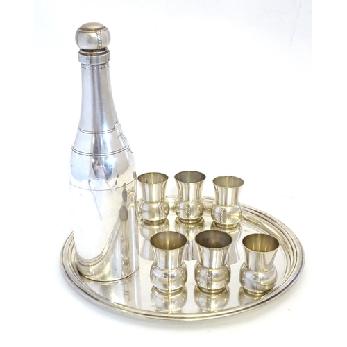 231 - A French novelty cocktail / tot set, the shaker formed as a bottle, the 6 shot / tot cups formed as ... 