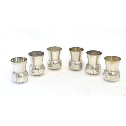 231 - A French novelty cocktail / tot set, the shaker formed as a bottle, the 6 shot / tot cups formed as ... 