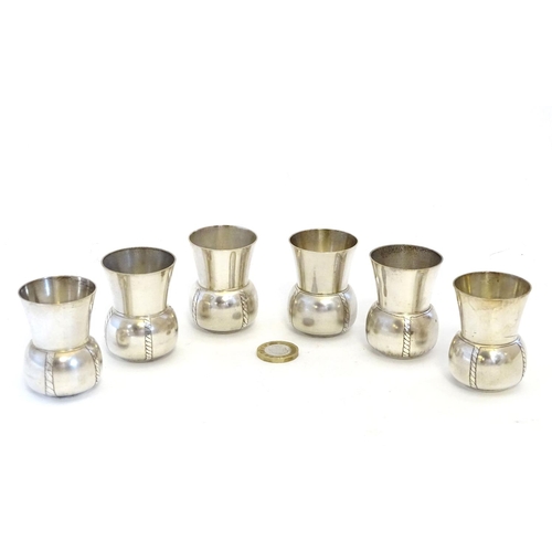 231 - A French novelty cocktail / tot set, the shaker formed as a bottle, the 6 shot / tot cups formed as ... 