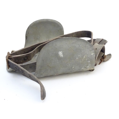 115 - Farming bygone: a galvanised steel bull headplate, the strap labelled 'Safety Bull Mask Co., 64 Dudl... 