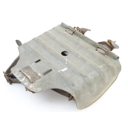 115 - Farming bygone: a galvanised steel bull headplate, the strap labelled 'Safety Bull Mask Co., 64 Dudl... 