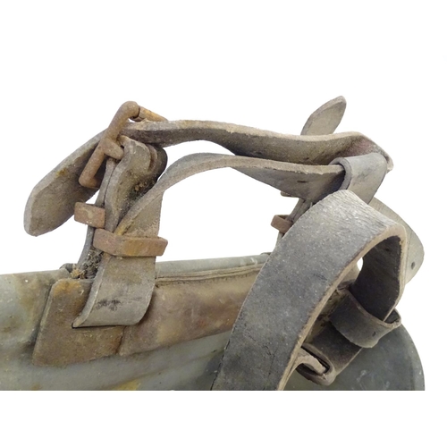 115 - Farming bygone: a galvanised steel bull headplate, the strap labelled 'Safety Bull Mask Co., 64 Dudl... 