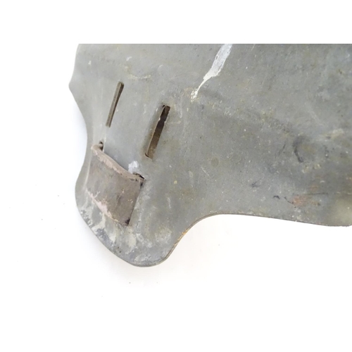 115 - Farming bygone: a galvanised steel bull headplate, the strap labelled 'Safety Bull Mask Co., 64 Dudl... 