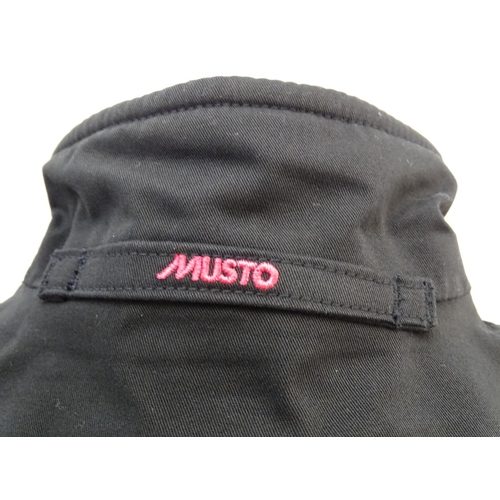 327 - A Musto black clay shooting jacket, ladies size 8, with tags