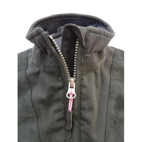 327 - A Musto black clay shooting jacket, ladies size 8, with tags