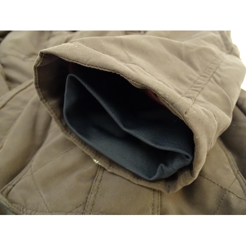 335 - A Musto brown jacket, ladies size 18, with tags