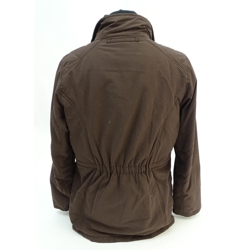 335 - A Musto brown jacket, ladies size 18, with tags