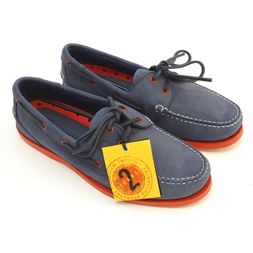 345 - A pair of Chatham red and navy deck shoes, size 9, new in box