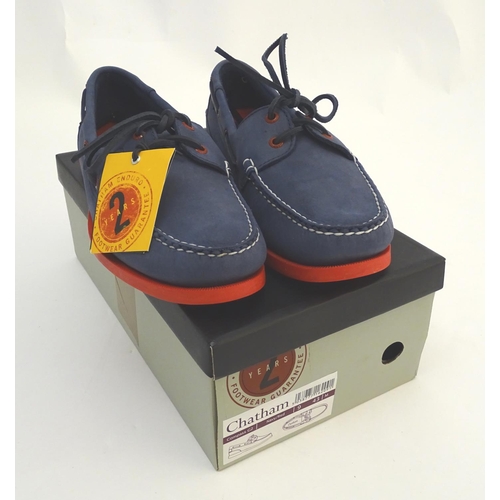 345 - A pair of Chatham red and navy deck shoes, size 9, new in box