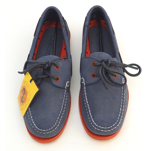 345 - A pair of Chatham red and navy deck shoes, size 9, new in box