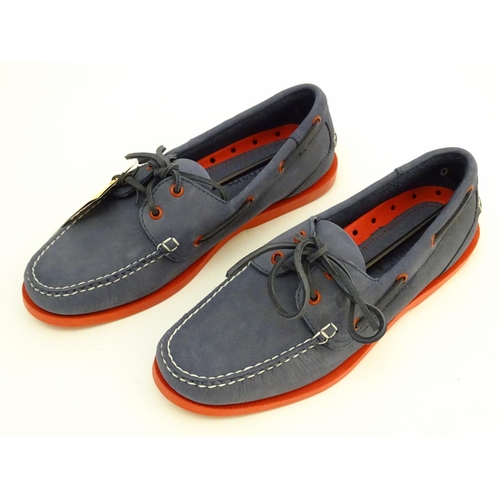 345 - A pair of Chatham red and navy deck shoes, size 9, new in box