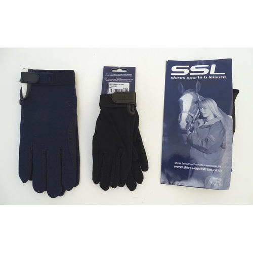 351 - Two pairs of children's black riding gloves, to include one leather pair and one cotton pair. Togeth... 
