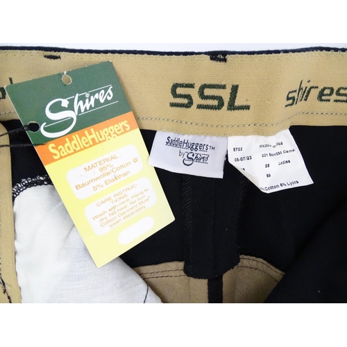 363 - Saddle Huggers by Shires black jodhpurs, ladies size 28, with tags