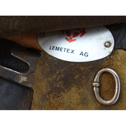 371 - A Lemetex brown leather horse riding / equestrian saddle. Approx. 17