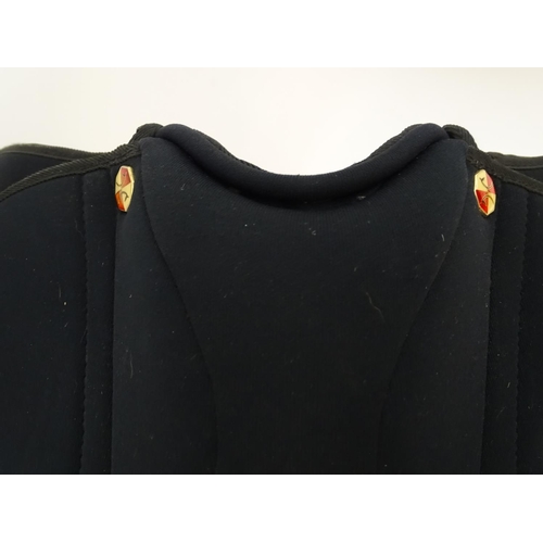 373 - A black narrow synthetic horse riding / equestrian saddle. Approx. 17