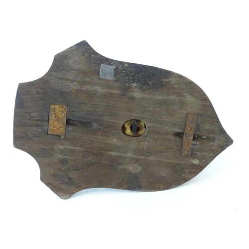 76 - Taxidermy: a mounted red deer hoof formed as a hanger, affixed to an oak shield, approximately 11 1/... 