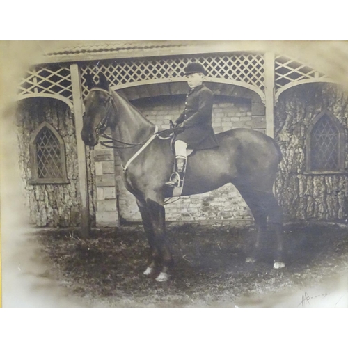 190 - A Victorian black and white photograph of a young boy on horseback. Signed lower right A. Richmond. ... 