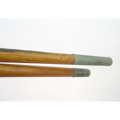 100 - A two part wooden kayak paddle with protective end caps. Each approx. 49 1/2