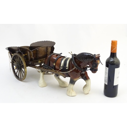 294 - A large ceramic shire horse with harness and reins, and hand / scratch built wooden cart. Horse appr... 
