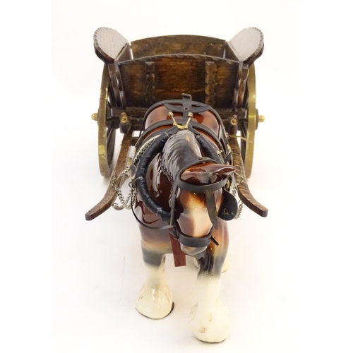 294 - A large ceramic shire horse with harness and reins, and hand / scratch built wooden cart. Horse appr... 