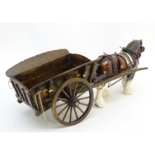 294 - A large ceramic shire horse with harness and reins, and hand / scratch built wooden cart. Horse appr... 
