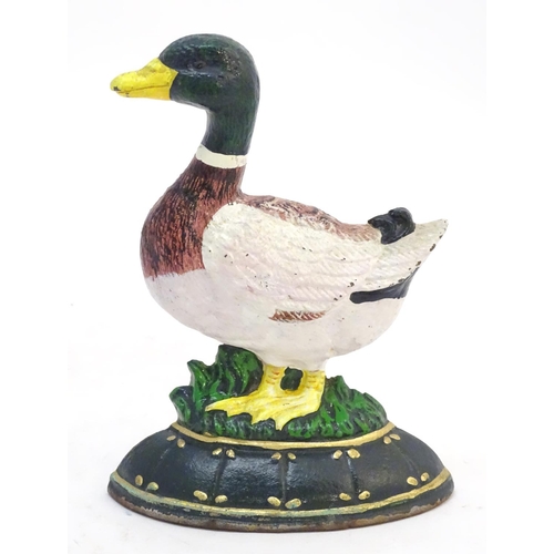 302 - A cast door stop / door porter formed as a duck with painted decoration. Approx. 7 1/4