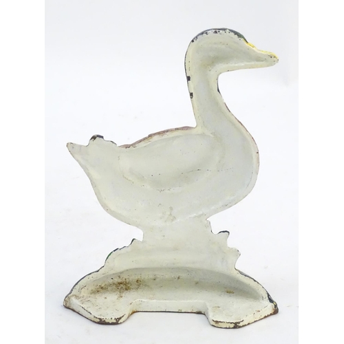302 - A cast door stop / door porter formed as a duck with painted decoration. Approx. 7 1/4