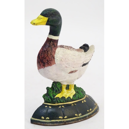 302 - A cast door stop / door porter formed as a duck with painted decoration. Approx. 7 1/4