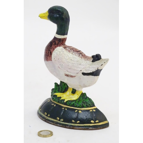 302 - A cast door stop / door porter formed as a duck with painted decoration. Approx. 7 1/4