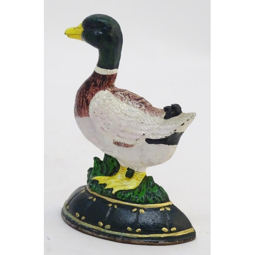 302 - A cast door stop / door porter formed as a duck with painted decoration. Approx. 7 1/4