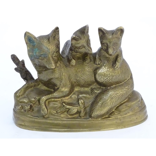 305 - A Continental cast sculpture depicting a fox and two fox cubs with traces of gilt finish. Approx. 4 ... 