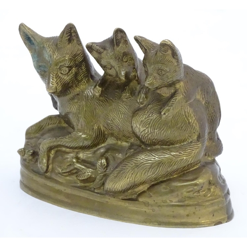 305 - A Continental cast sculpture depicting a fox and two fox cubs with traces of gilt finish. Approx. 4 ... 