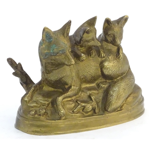 305 - A Continental cast sculpture depicting a fox and two fox cubs with traces of gilt finish. Approx. 4 ... 