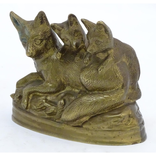 305 - A Continental cast sculpture depicting a fox and two fox cubs with traces of gilt finish. Approx. 4 ... 
