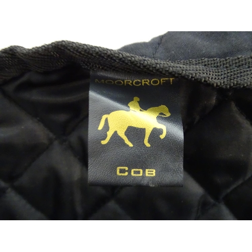 392 - A black quilted equestrian / horse under rug / shoulder protector, medium.