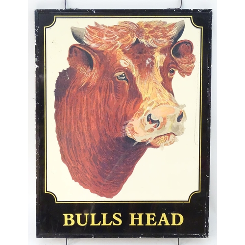 1034 - A 20thC pub sign, 'Bull's Head', with printed lettering and illustration of an Ayrshire bull, 44 1/2... 