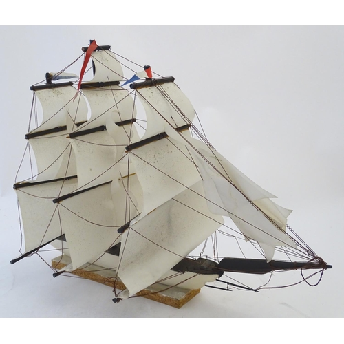 1040 - An early 20thC scratch built naive model of three mast ship / boat with flags to include Bavaria and... 