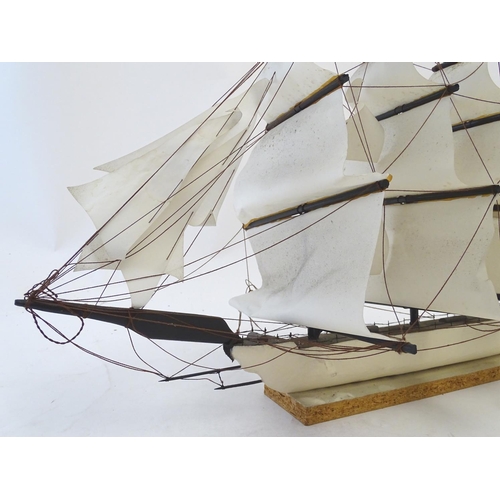 1040 - An early 20thC scratch built naive model of three mast ship / boat with flags to include Bavaria and... 