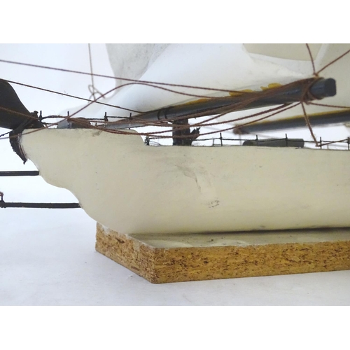 1040 - An early 20thC scratch built naive model of three mast ship / boat with flags to include Bavaria and... 