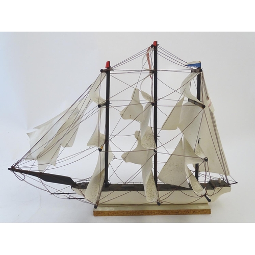 1040 - An early 20thC scratch built naive model of three mast ship / boat with flags to include Bavaria and... 