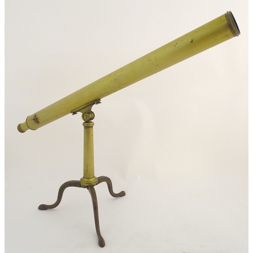 1042 - A 19thC brass two-draw telescope and removable folding tripod stand, the extended barrel measuring 5... 