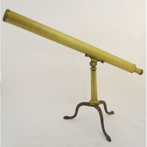 1042 - A 19thC brass two-draw telescope and removable folding tripod stand, the extended barrel measuring 5... 