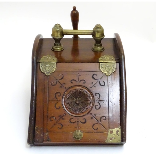 1016 - An early 20thC carved pine coal scuttle, the lid with central floral motif, brass furniture, removab... 