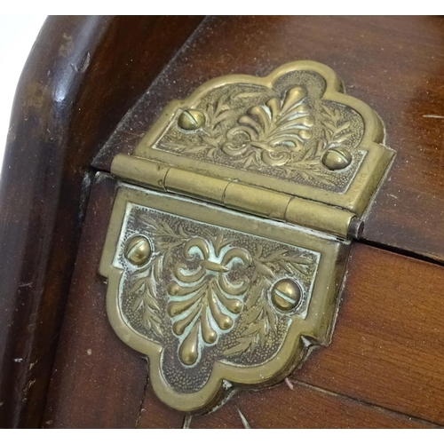 1016 - An early 20thC carved pine coal scuttle, the lid with central floral motif, brass furniture, removab... 