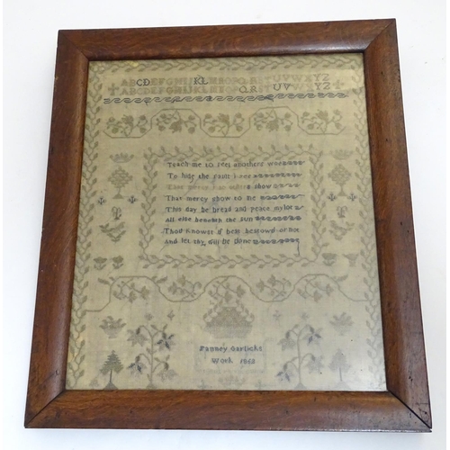 1026 - A Victorian needlework sampler decorated with a verse from The Universal Prayer surrounded by scroll... 