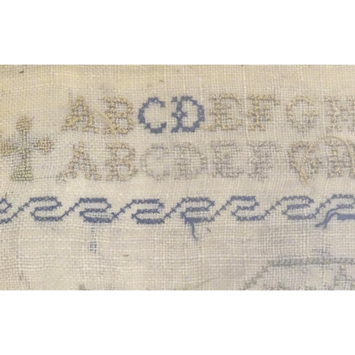 1026 - A Victorian needlework sampler decorated with a verse from The Universal Prayer surrounded by scroll... 