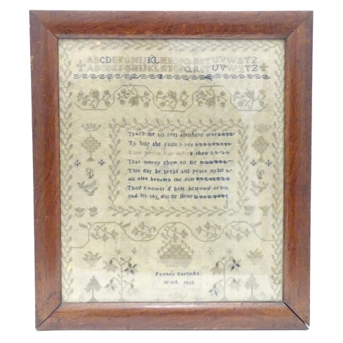 1026 - A Victorian needlework sampler decorated with a verse from The Universal Prayer surrounded by scroll... 