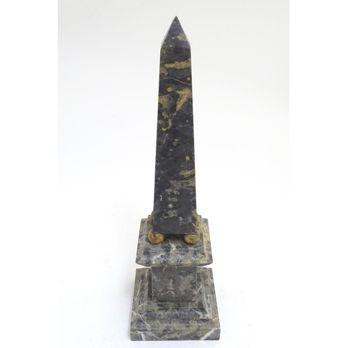 1029 - A grey-white marble miniature obelisk, with ball feet, standing on a stepped plinth, 16